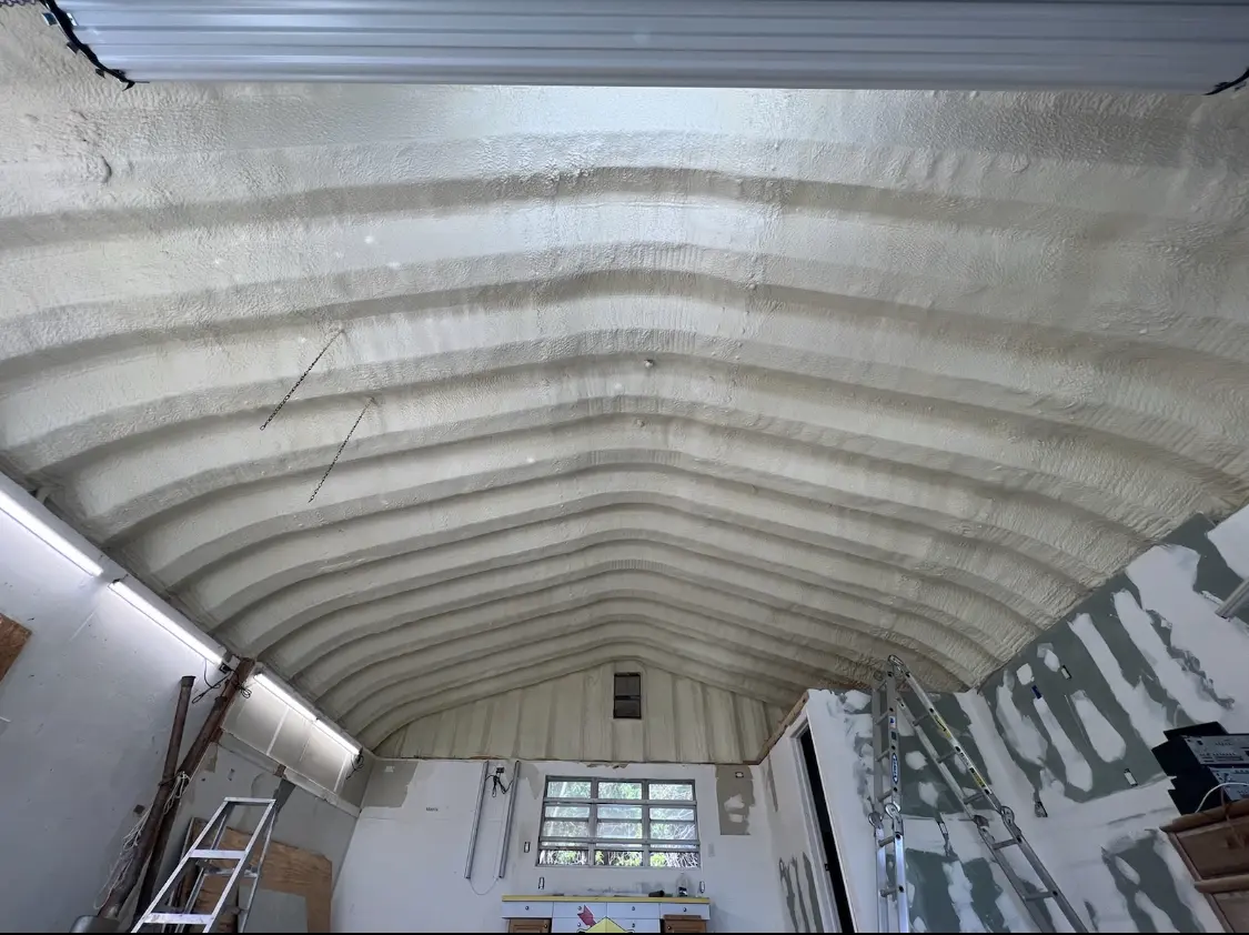 Spray polyurethane foam applied to the underside of a metal roof deck in Lee's Summit